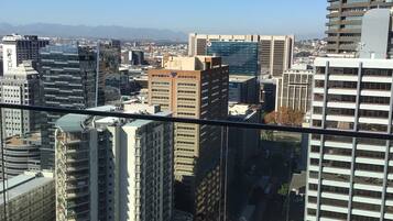 A cityscape with various buildings, including a mix of modern and older architecture.