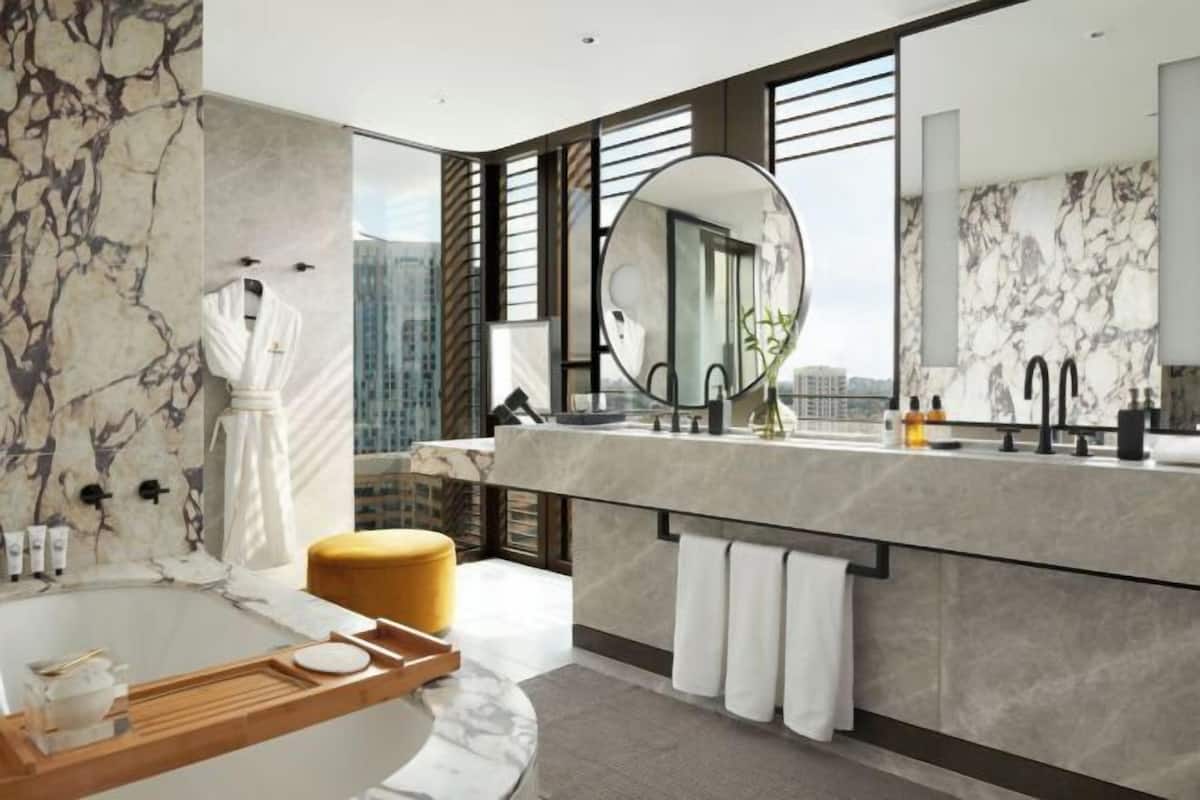 Bathroom | Designer toiletries, hair dryer, bathrobes, slippers