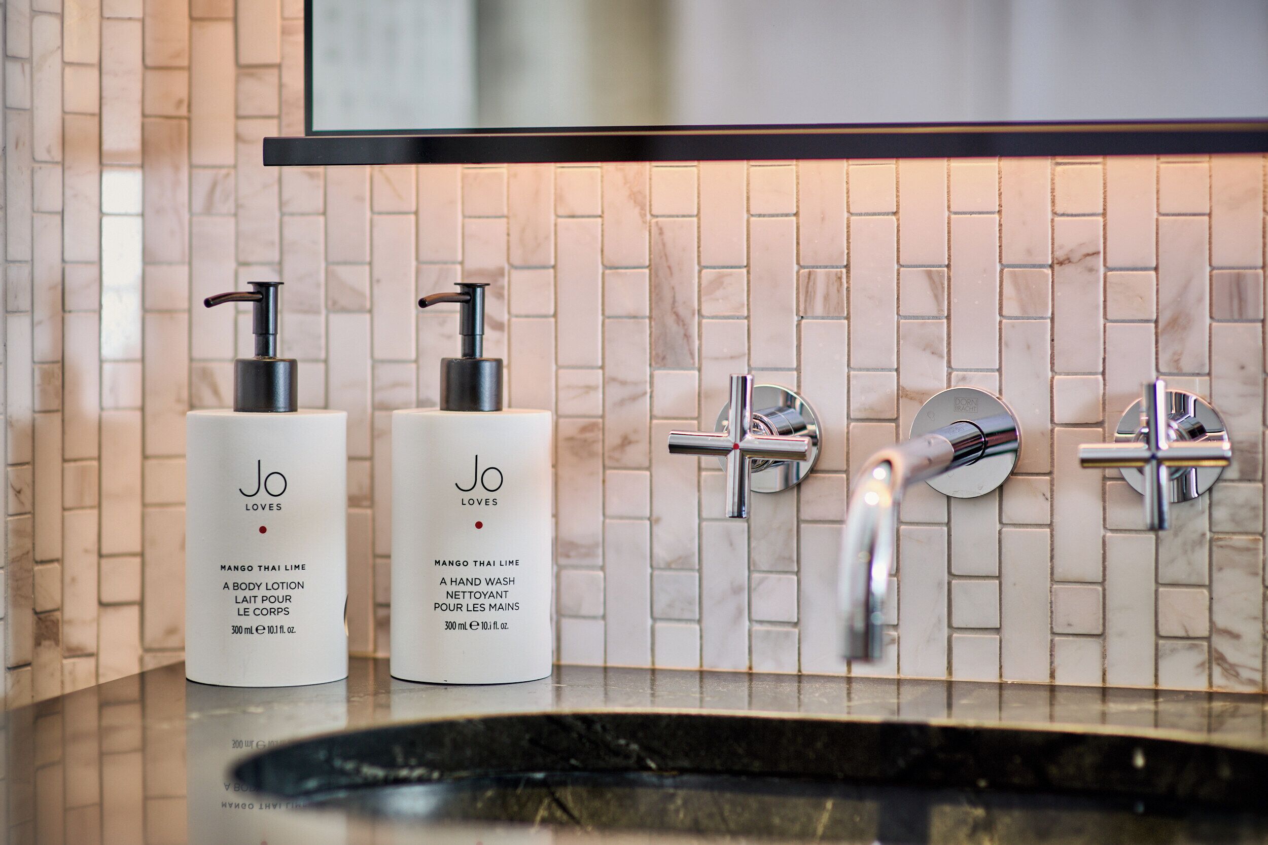 designer toiletries, hair dryer, bathrobes, slippers