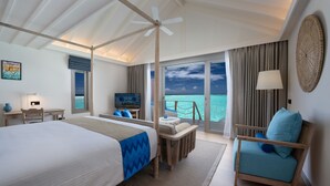 A room with a bed, a TV, a chair, and a view of the ocean. - Cora Cora Maldives-Premium All-Inclusive (Maamigili Island)