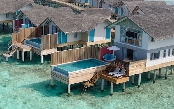 Overwater bungalows with private pools, wooden walkways, and clear turquoise water. - Cora Cora Maldives-Premium All-Inclusive (Maamigili Island)