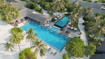 2 outdoor pools, open 7:00 AM to 6:00 PM, pool umbrellas, pool loungers