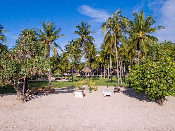 On the beach, sun loungers, beach umbrellas, beach towels