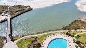 A coastal resort with a swimming pool, beach access, and a bridge over water. - One of a Kind Penthouse--All New! A Beach Lover's Dream Vacation Rental+Locker!! (Myrtle Beach)