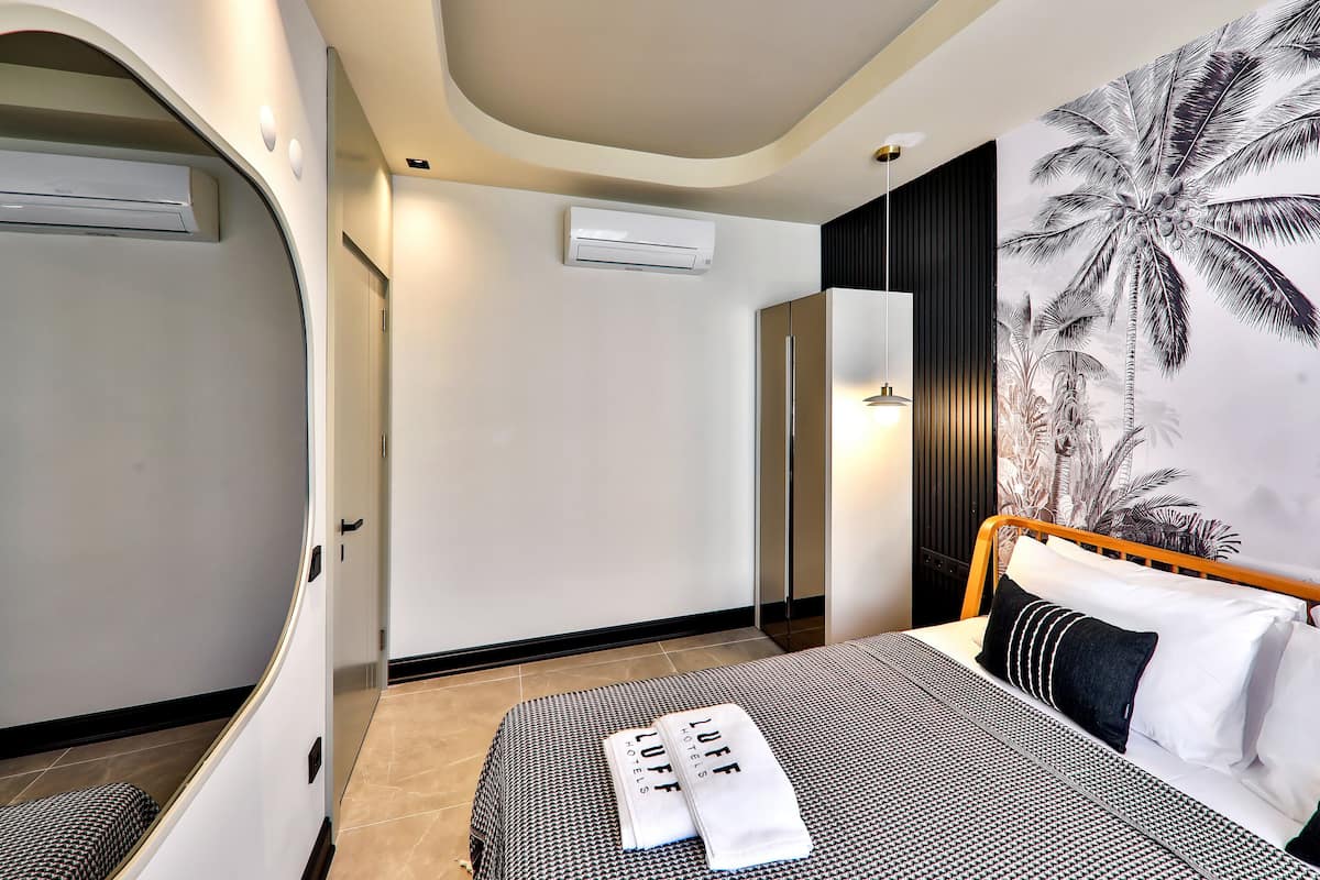 family suite, 2 bedrooms, balcony | premium bedding, free minibar items, desk, laptop workspace