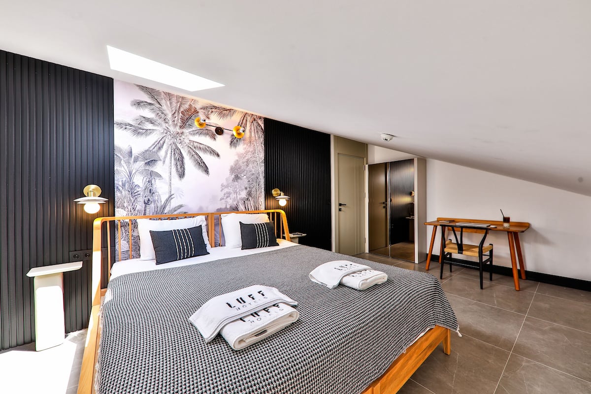 economy loft | premium bedding, free minibar items, desk, laptop workspace