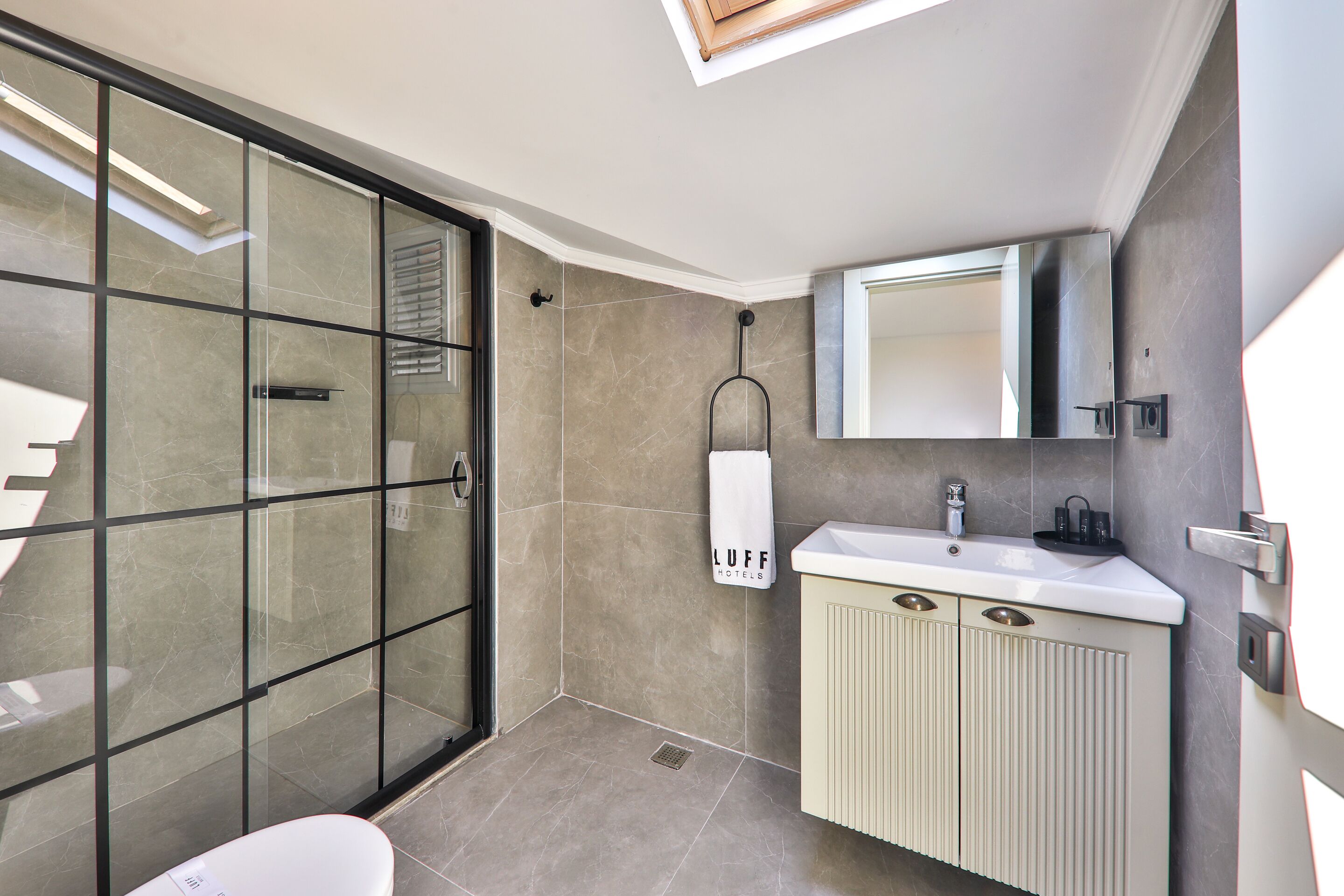 economy loft | bathroom | shower, free toiletries, hair dryer, slippers