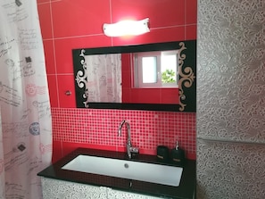 Bathtub, hair dryer, towels, soap