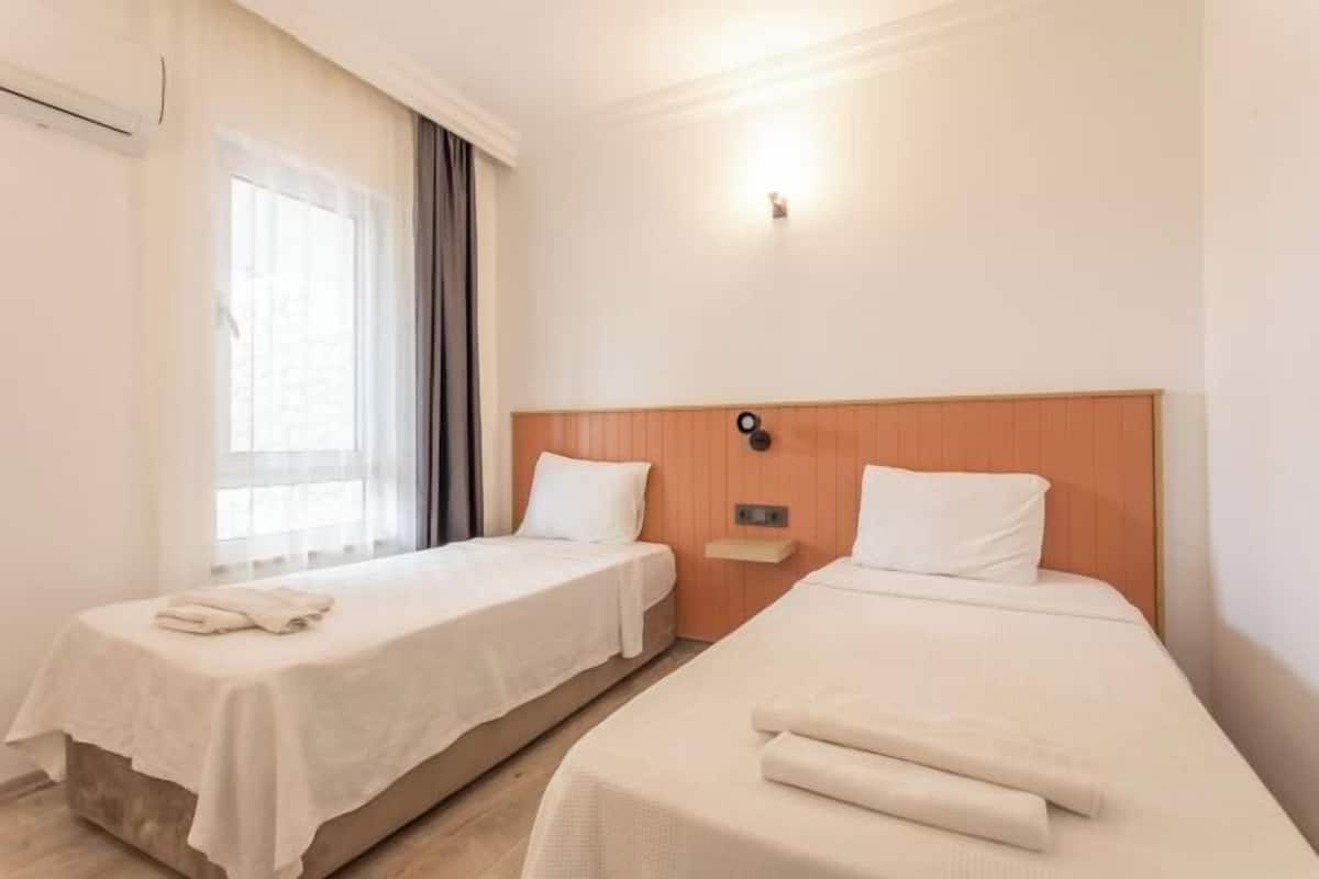 Premium bedding, desk, laptop workspace, soundproofing