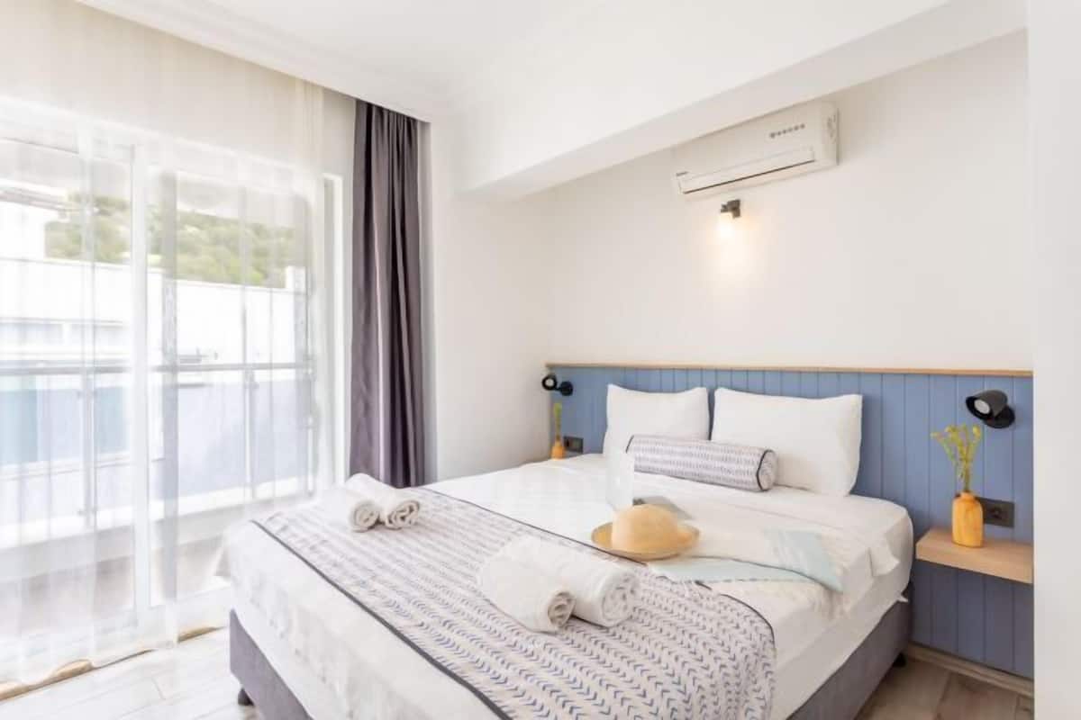 Premium bedding, desk, laptop workspace, soundproofing