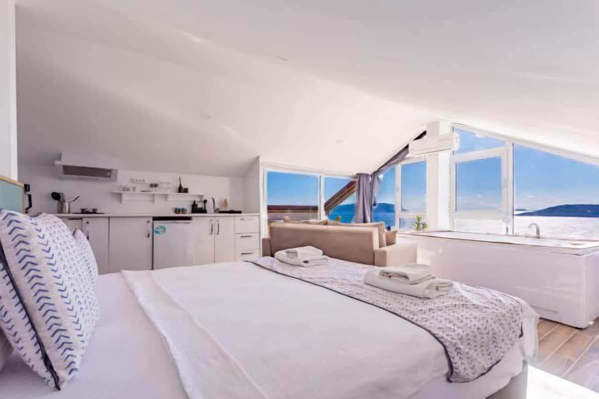 Premium bedding, desk, laptop workspace, soundproofing