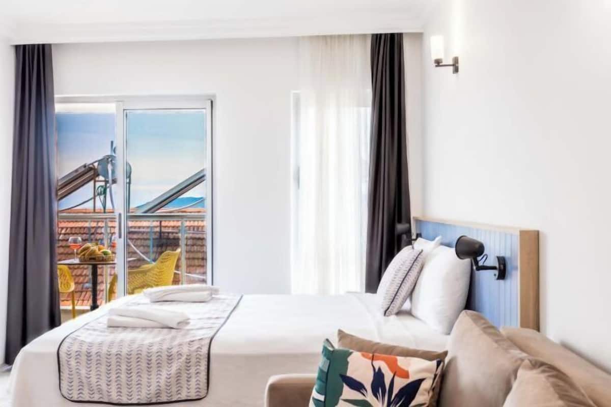 Premium bedding, desk, laptop workspace, soundproofing