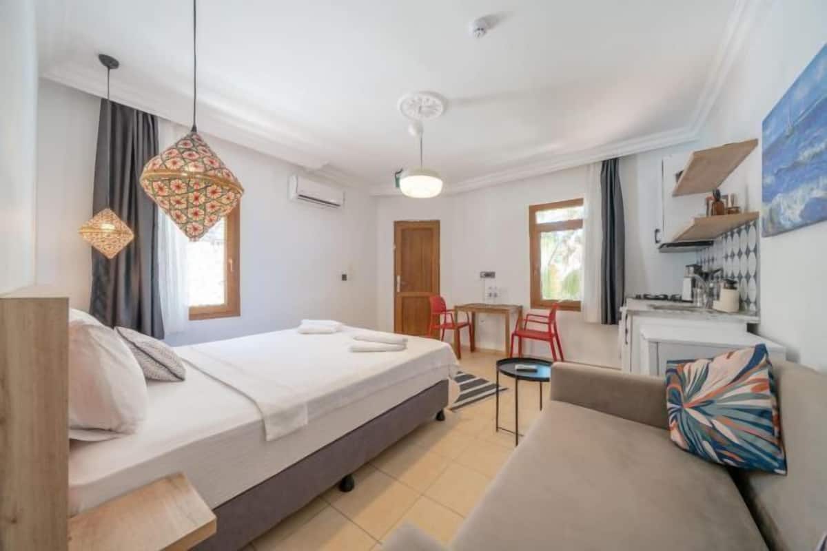 Premium bedding, desk, laptop workspace, soundproofing