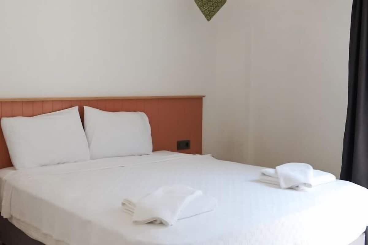 Premium bedding, desk, laptop workspace, soundproofing