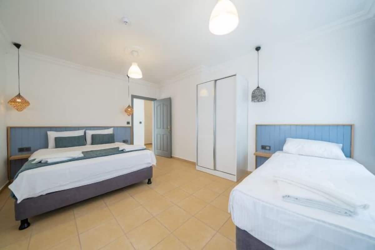 Premium bedding, desk, laptop workspace, soundproofing