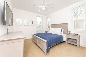 A bedroom with a bed, nightstands, a TV, and artwork on the wall. - Days Like This at The Lookout at Lake Chelan (Chelan)
