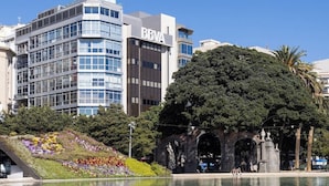 A modern building with a glass facade and the sign 'BBVA'.