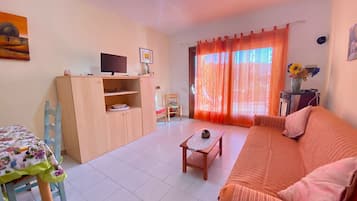 Apartment, 2 Bedrooms | Living room | 22-inch flat-screen TV with cable channels, TV