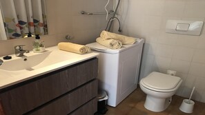 Bathtub, hair dryer, towels