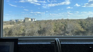 A view from a window overlooking a residential area with houses and trees. - Romantic Little Getaway in 4X4 beach (Corolla)