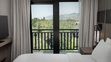 Premium bedding, desk, laptop workspace, soundproofing