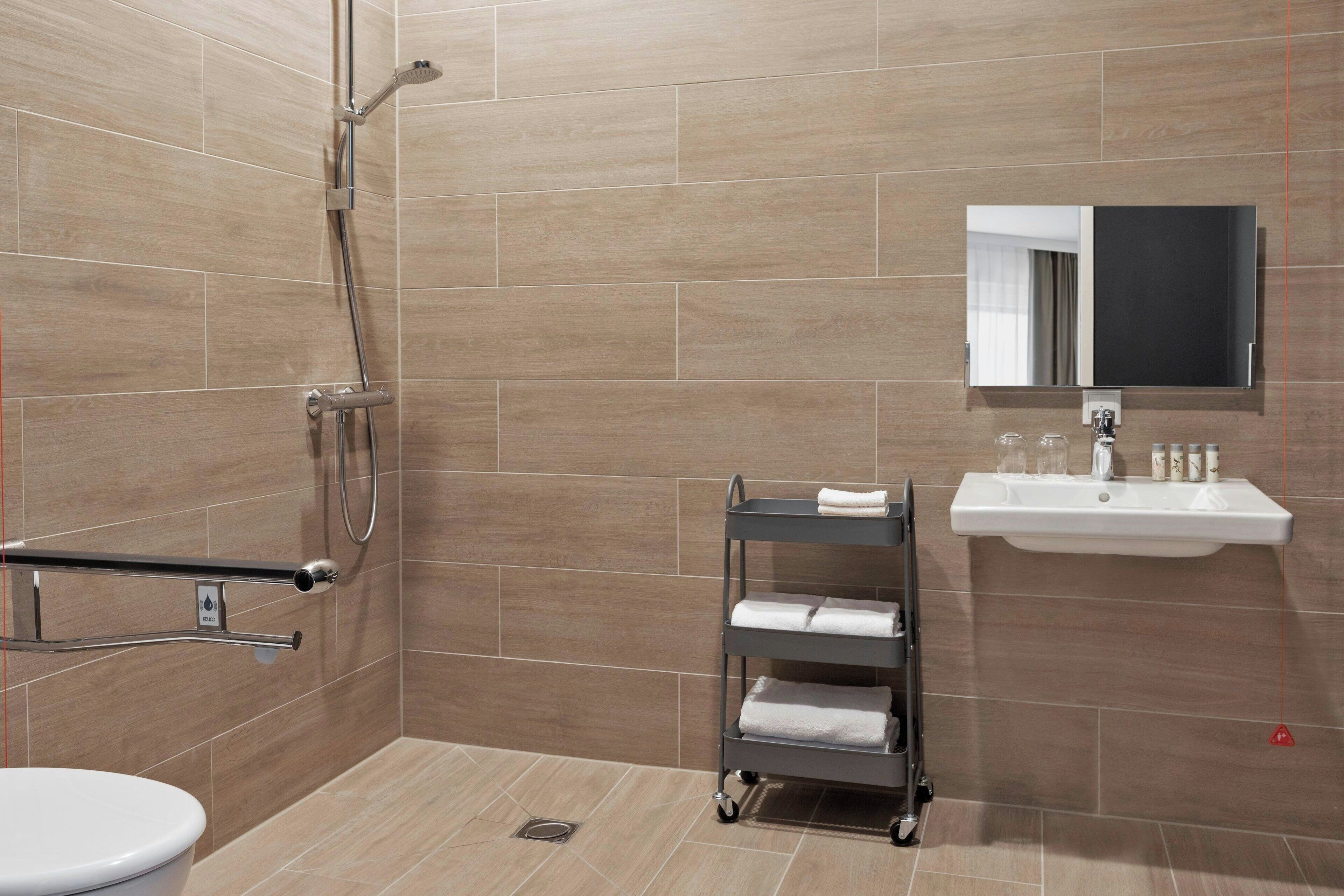 comfort studio, 1 king bed | bathroom | shower, free toiletries, hair dryer, soap