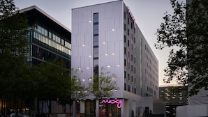 A modern building with a prominent neon sign reading "mozy" at the entrance. - Moxy Milton Keynes (Milton Keynes)