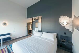 Deluxe Loft, 1 King Bed, Corner | In-room safe, desk, laptop workspace, blackout drapes