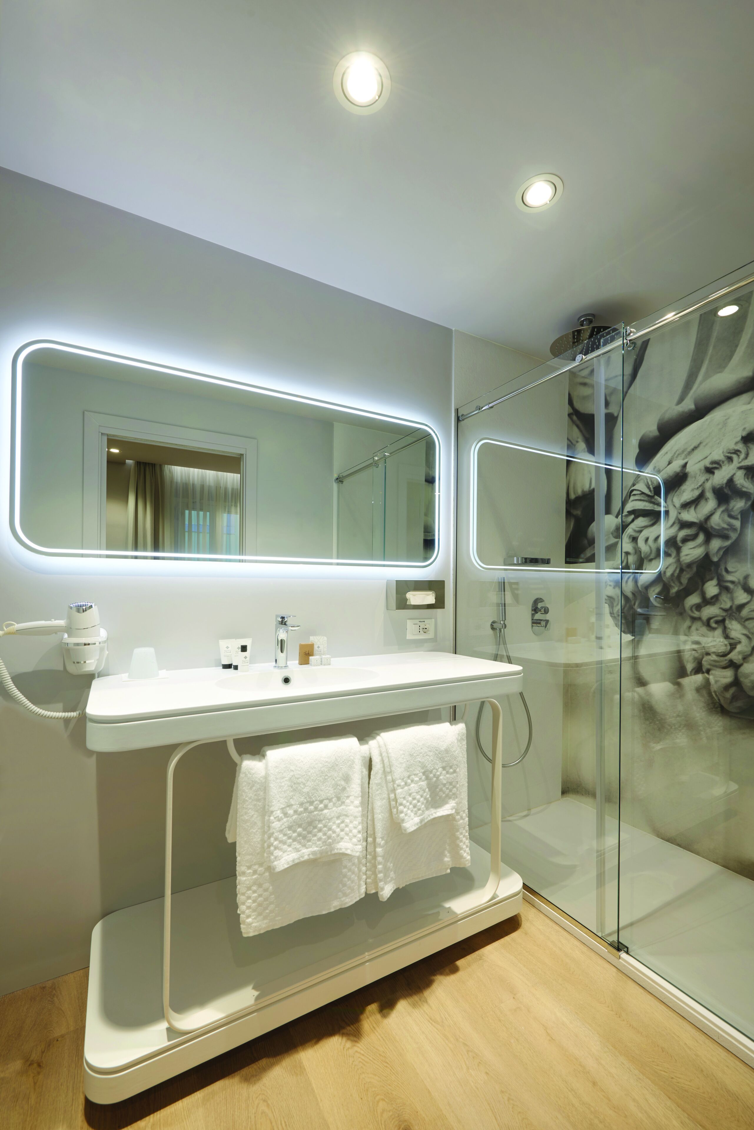 deluxe suite | bathroom | shower, free toiletries, hair dryer, bathrobes