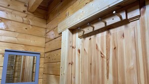 A wooden cabin interior with a window and a door. - Immaculate Cabin 5 Mins to Inverness Dog Friendly (Inverness)