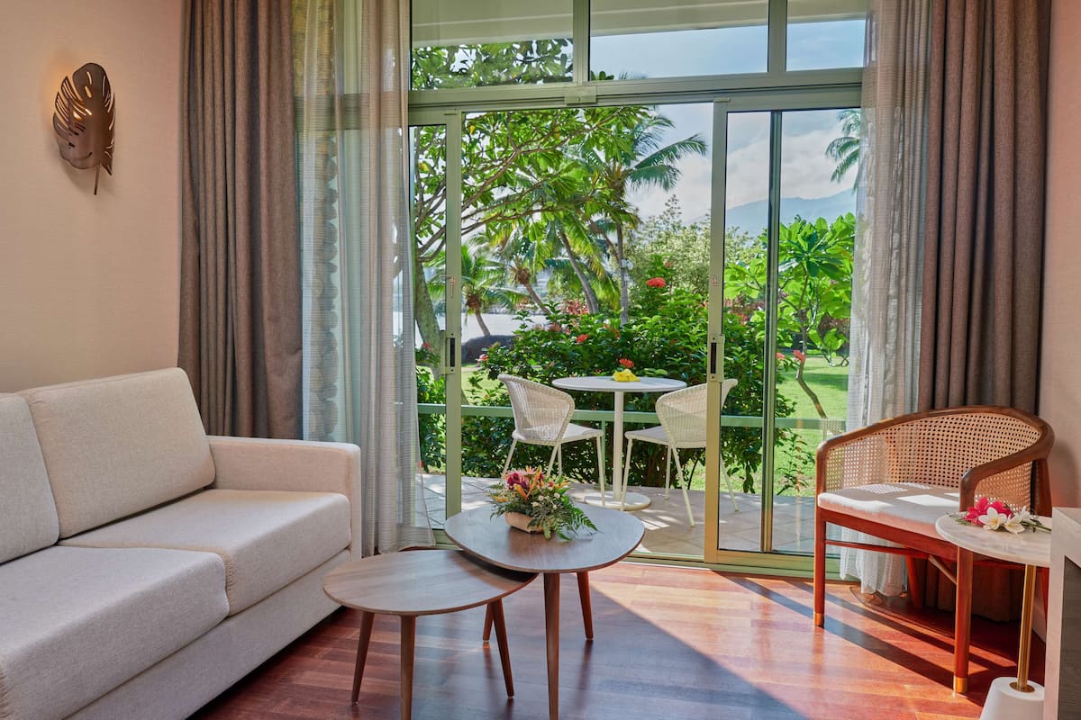 room, 1 king bed, garden view | living area | 55-inch led tv with cable channels, tv