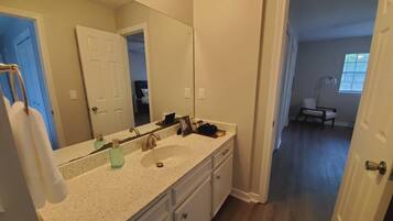 Combined shower/tub, hair dryer, towels, soap