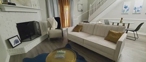 Smart TV, fireplace, books, computer monitors