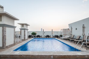 Outdoor pool, open 9:00 AM to 11:30 PM, free pool cabanas