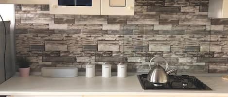 Fridge, microwave, stovetop, coffee/tea maker