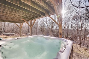 A hot tub under a wooden pergola with a forest backdrop. - Secluded Retreat w Beach/Lake Access: Hot Tub, BBQ, Sleeps 16 (Blakeslee)