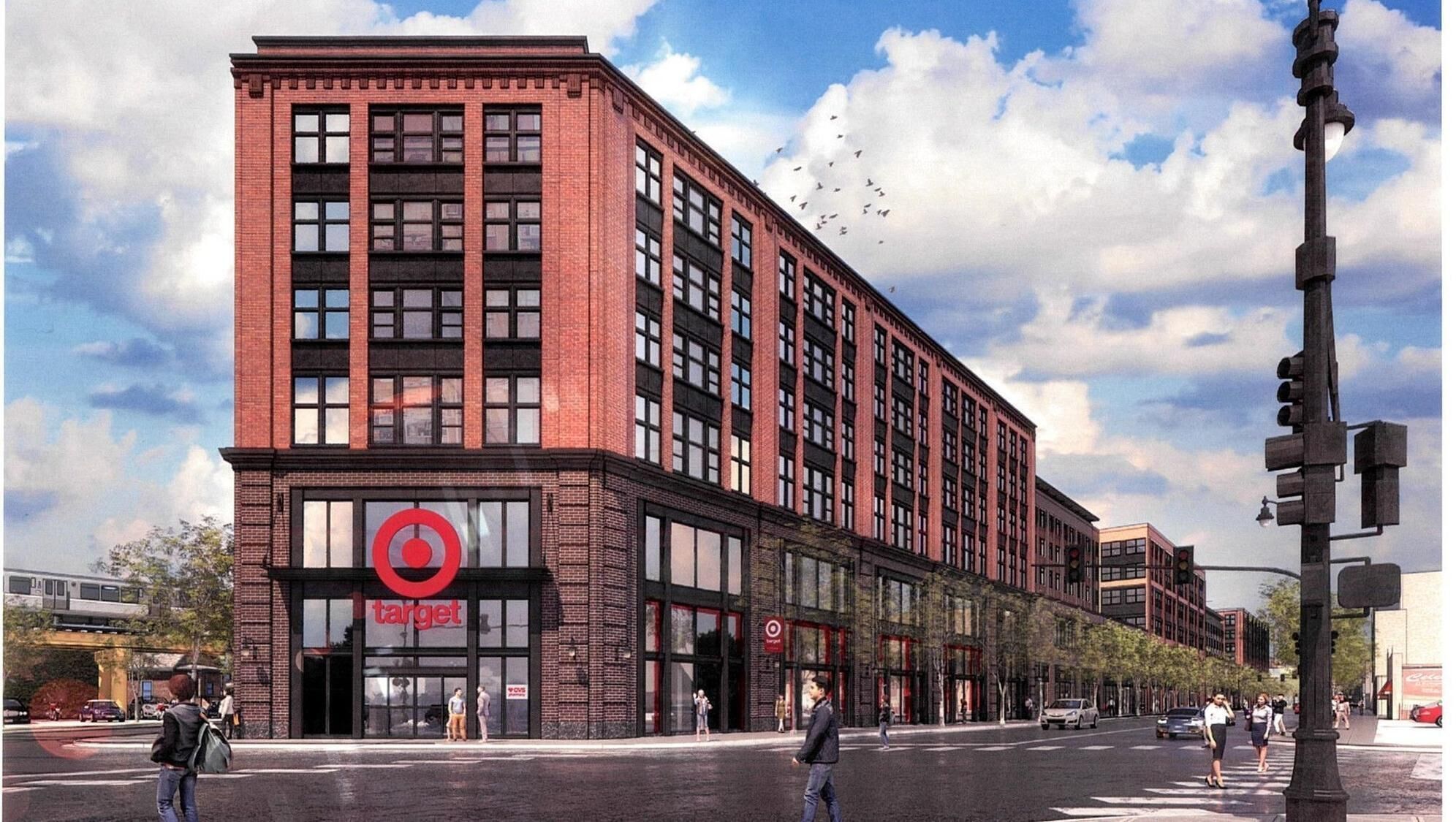 A Target store with a brick facade and large windows, located at a street corner with pedestrians and cars.