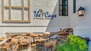 A building with a sign reading "The Cays at Downtown Ocotillo."