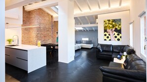 A modern interior with a kitchen, dining area, and living space.