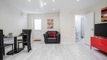 Apartment | Living room | 30-inch TV with digital channels