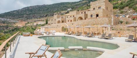 Seasonal outdoor pool, open 9:00 AM to 9:00 PM, sun loungers