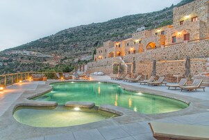 Seasonal outdoor pool, open 9:00 AM to 9:00 PM, pool loungers