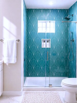 Shower, hair dryer, towels, soap