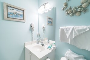 A bathroom with a sink, mirror, and towel rack. - Beautiful Golf Villa, 2.7 Miles To Beach + Free Attraction Tickets! (North Myrtle Beach)