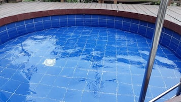 Seasonal outdoor pool, pool umbrellas, pool loungers