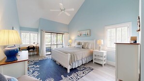 A bedroom with a bed, desk, chair, and a view of the outdoors. - Large Three Bedroom Villa Directly on George Fazio Championship Golf Course! (Hilton Head)