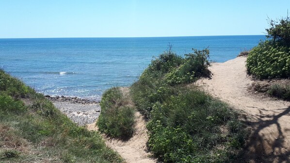 Beach nearby, sun loungers