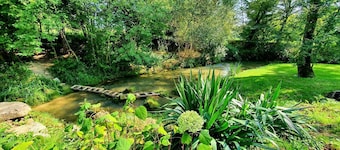 Renovated mill on the edge of its stream in a green setting in Lauzerte