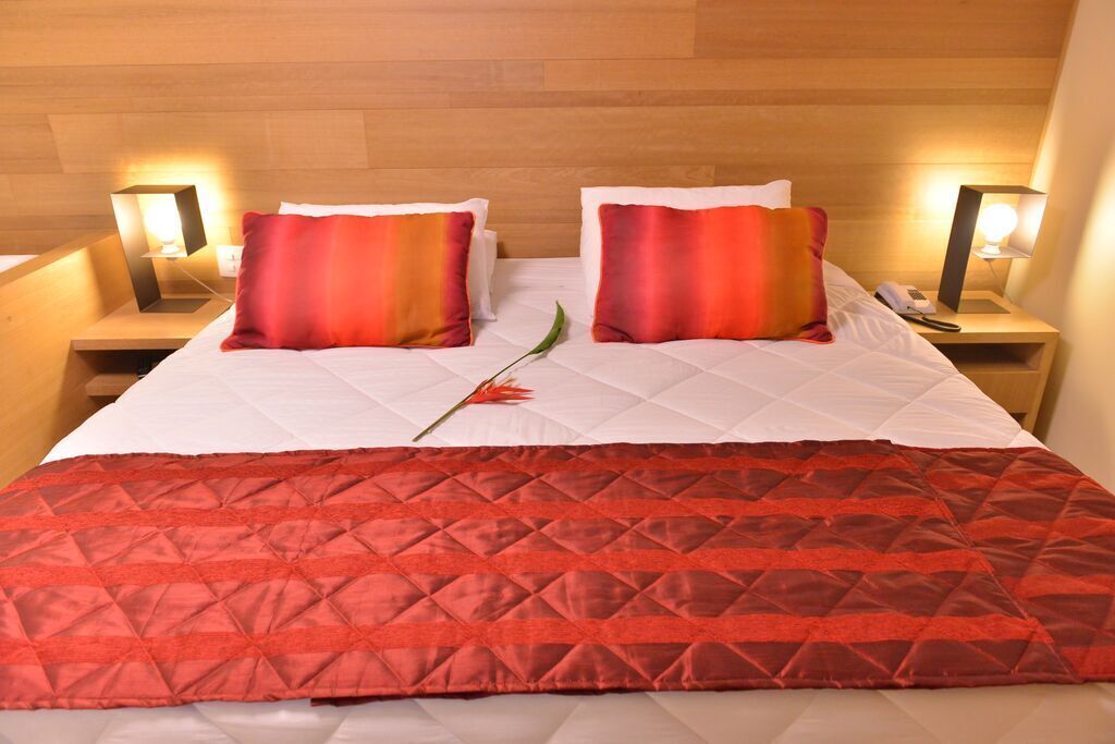 deluxe room | premium bedding, minibar, in-room safe, desk