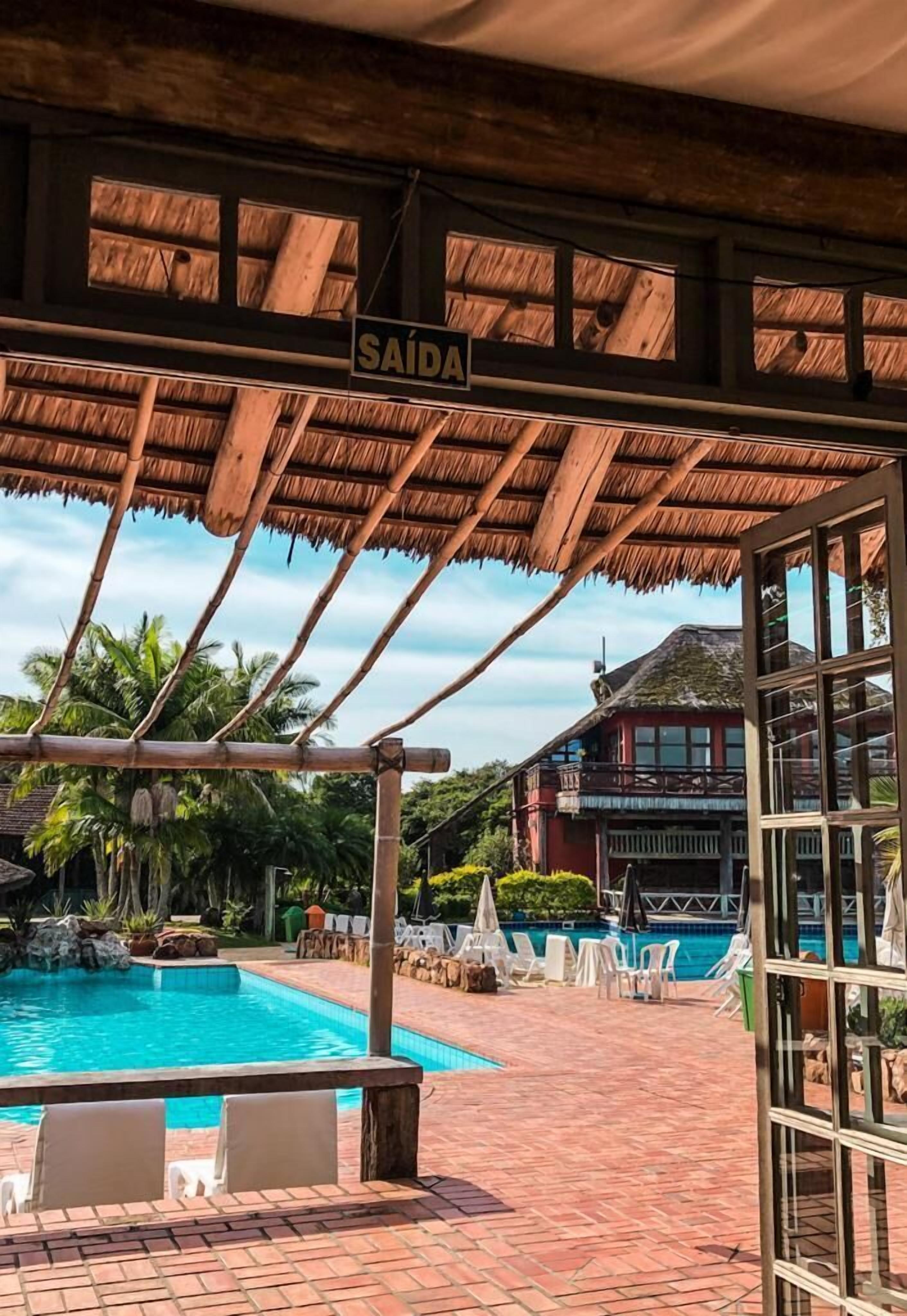 indoor pool, outdoor pool, pool umbrellas, pool loungers